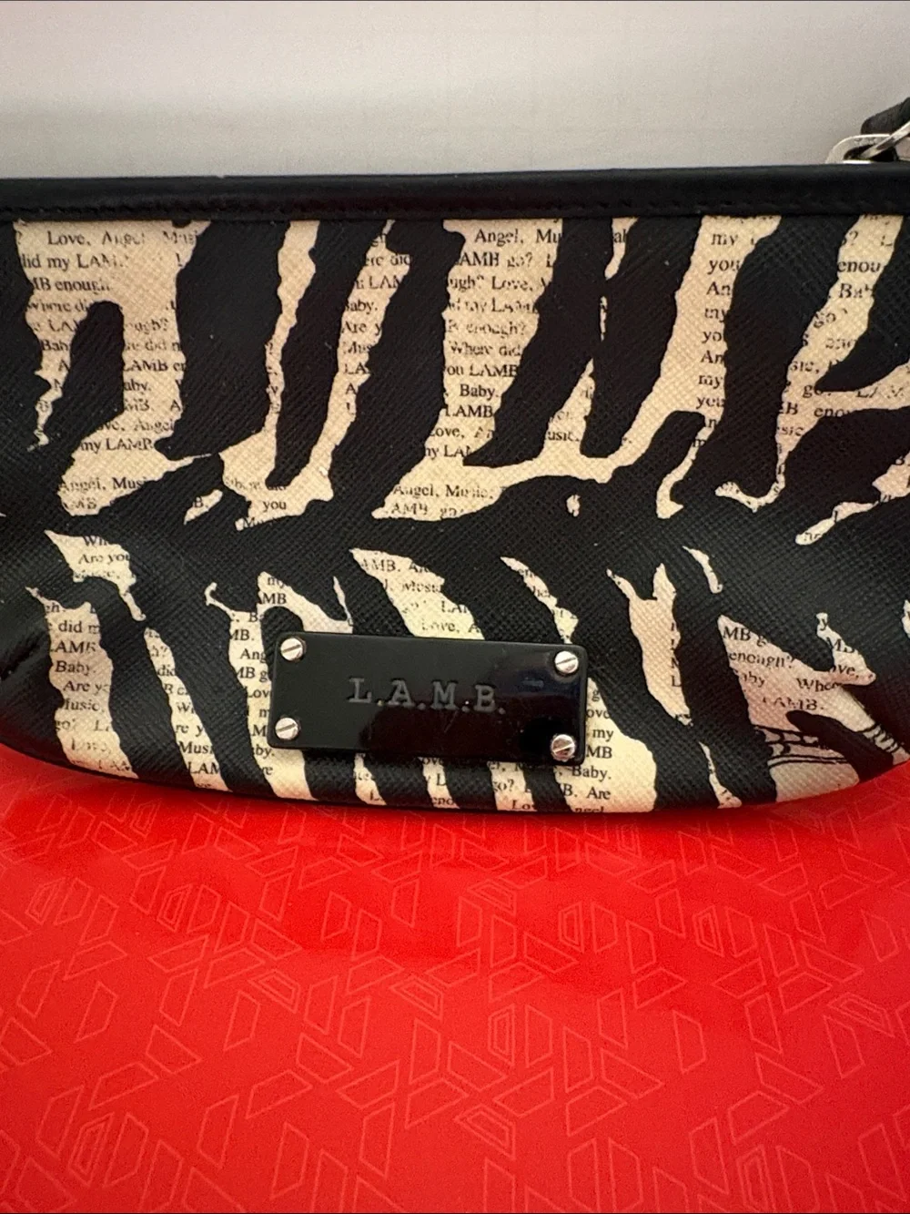 L.A.M.B. Black and Cream Zebra-Print Clutch with Logo Plate
